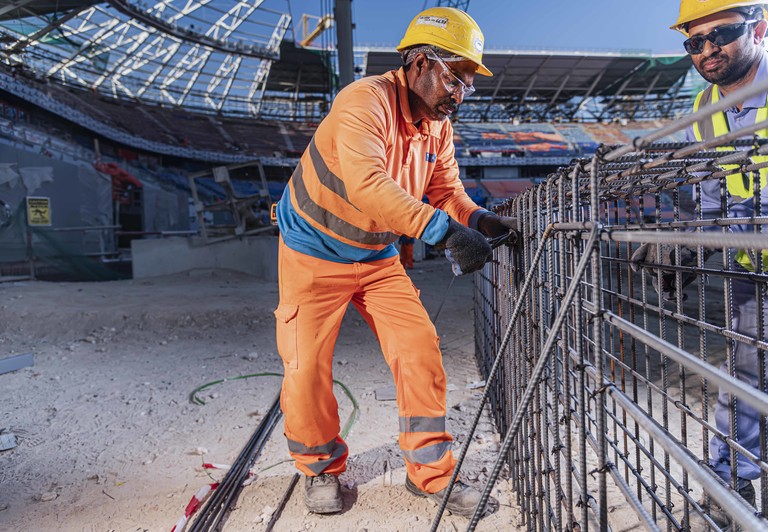 Workers at a FIFA World Cup Qatar 2022™ construction site